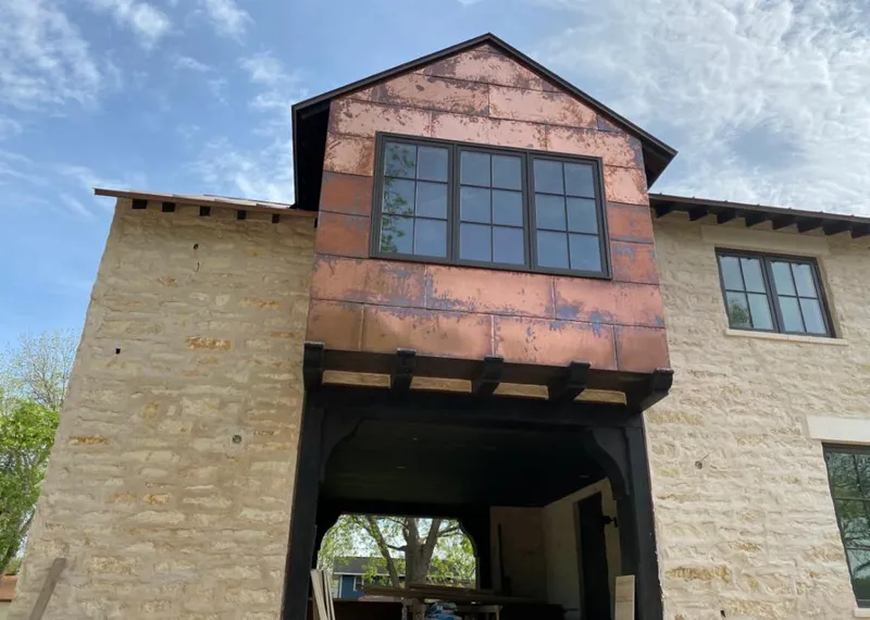 Copper metal panel facade on a stone building for Metal Roof Coating in Egg Harbor
